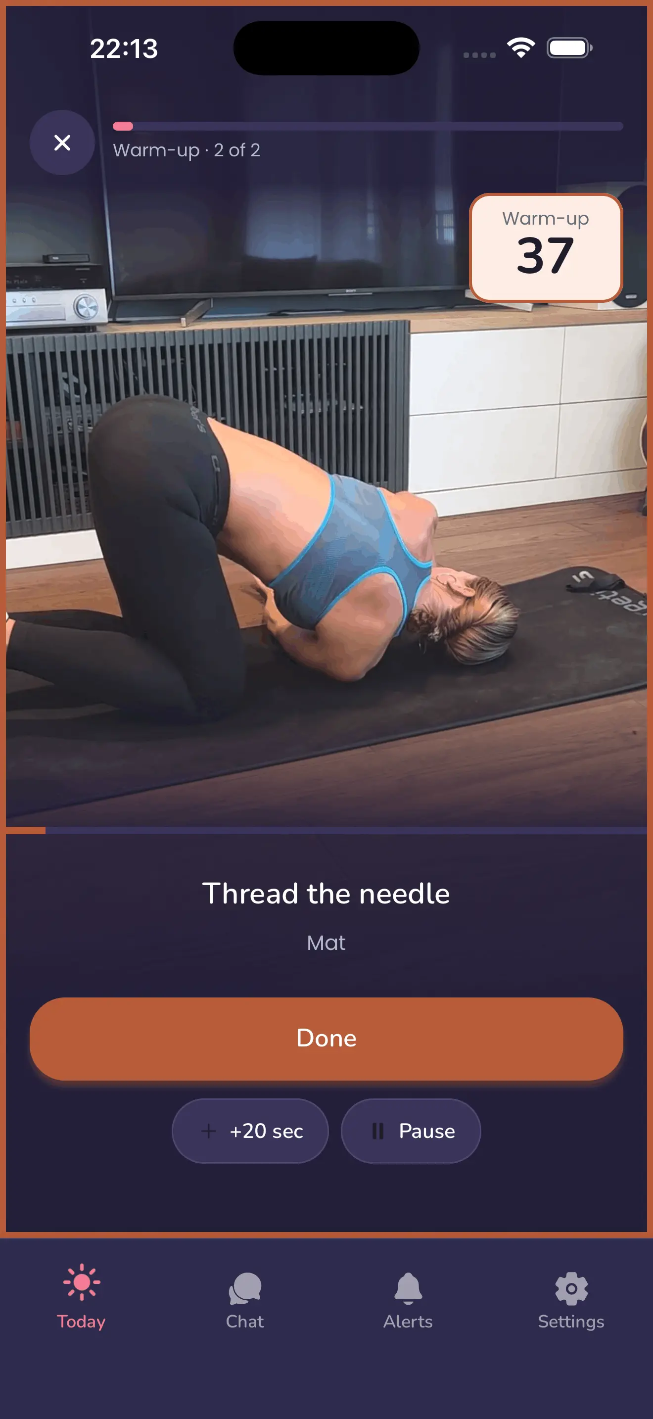 A session running in the MenoLisa app: a warm-up stretch shown on video with a countdown timer, and Done, +20 sec and Pause buttons